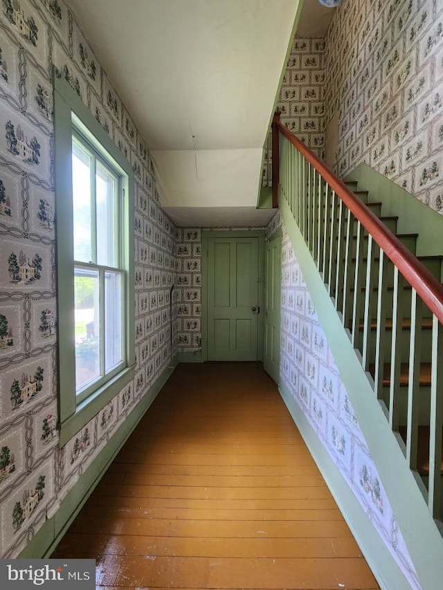 6428 Quantico Rd, Quantico, MD 21856 - staircase with wallpapered walls and hardwood / wood-style floors