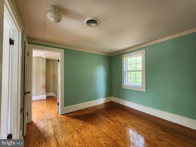 6428 Quantico Rd, Quantico, MD 21856 - unfurnished room featuring wood finished floors, baseboards, and crown molding