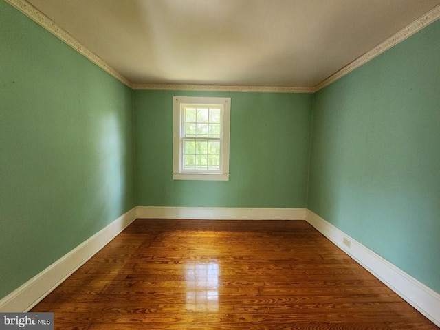 6428 Quantico Rd, Quantico, MD 21856 - empty room with crown molding, wood finished floors, and baseboards