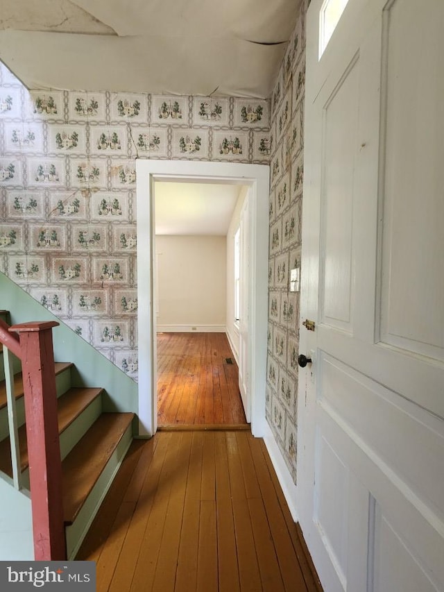 6428 Quantico Rd, Quantico, MD 21856 - corridor with wallpapered walls, hardwood / wood-style flooring, stairs, and baseboards