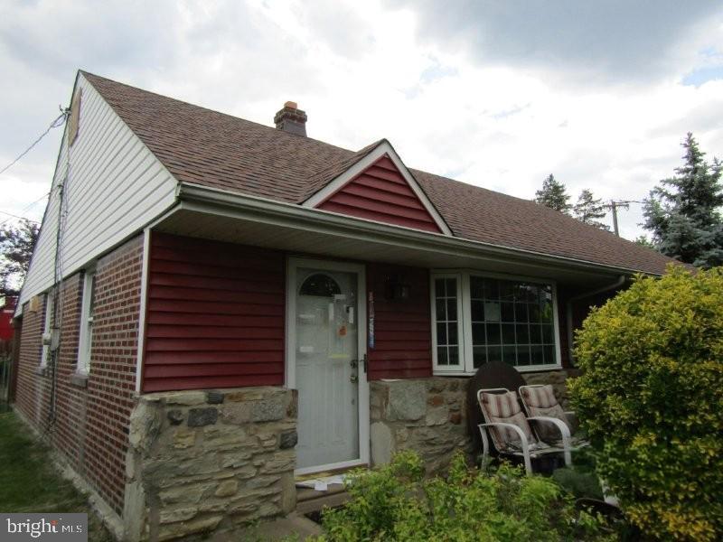 3100 Welsh Rd, Philadelphia, PA 19136 - view of front of property with a chimney, a shingled roof, stone siding, and brick siding