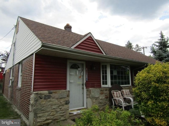 3100 Welsh Rd, Philadelphia, PA 19136 - view of front of property with a chimney, a shingled roof, stone siding, and brick siding