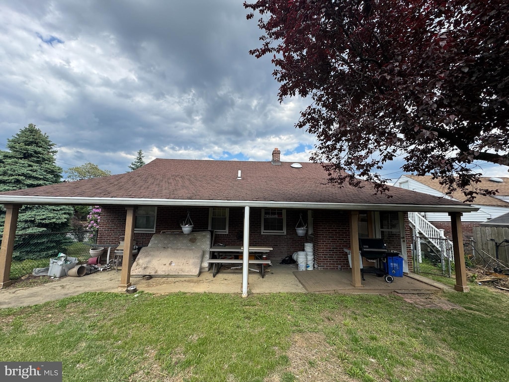 3100 Welsh Rd, Philadelphia, PA 19136 - back of house with brick siding, a patio area, a chimney, and a shingled roof