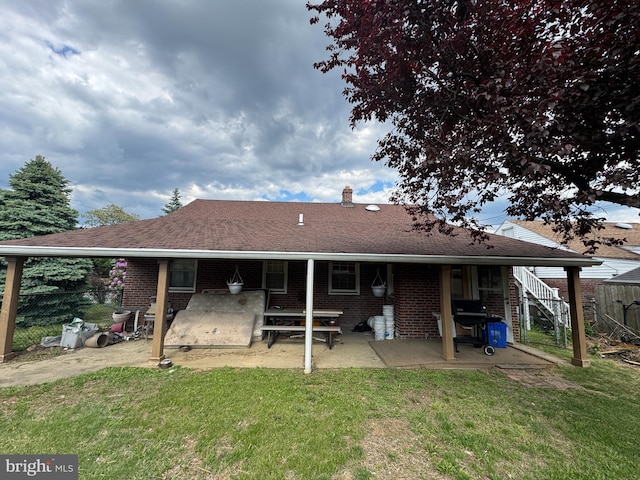 3100 Welsh Rd, Philadelphia, PA 19136 - back of house with brick siding, a patio area, a chimney, and a shingled roof