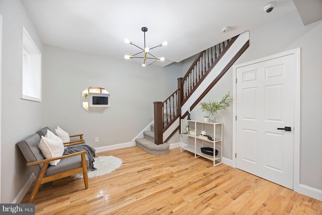 5300 Merceron Ave, Baltimore, MD 21207 - sitting room with wood finished floors, stairs, a chandelier, and baseboards