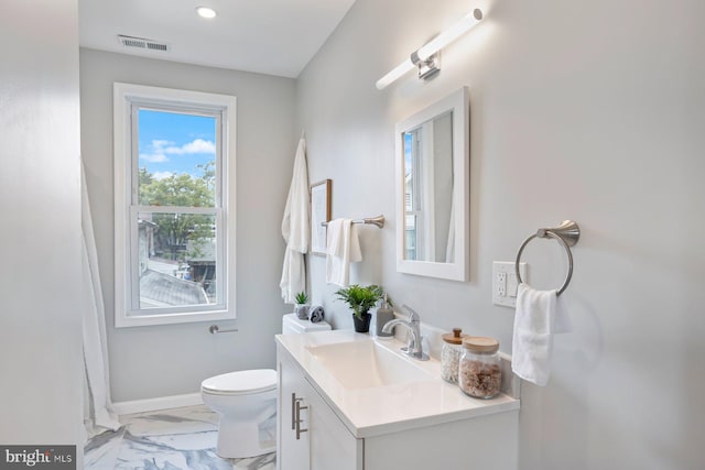 5300 Merceron Ave, Baltimore, MD 21207 - bathroom featuring vanity, marble look tile flooring, toilet, baseboards, and recessed lighting