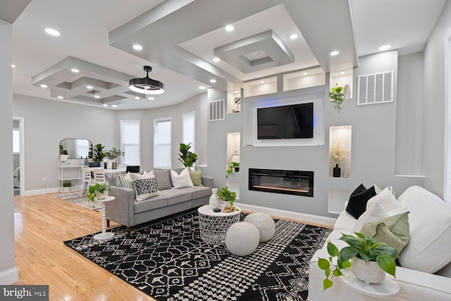5300 Merceron Ave, Baltimore, MD 21207 - living area with wood finished floors, baseboards, a glass covered fireplace, recessed lighting, and coffered ceiling