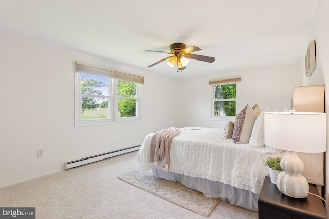 26140 Mullinix Mill Rd, Mount Airy, MD 21771 - carpeted bedroom featuring a baseboard heating unit, multiple windows, and ceiling fan