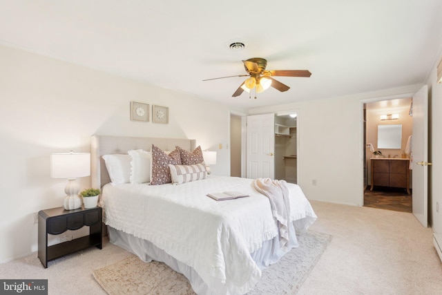 26140 Mullinix Mill Rd, Mount Airy, MD 21771 - carpeted bedroom featuring ensuite bathroom, a walk in closet, a ceiling fan, and a closet