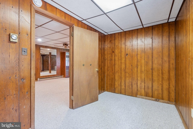 26140 Mullinix Mill Rd, Mount Airy, MD 21771 - empty room with carpet flooring, wood walls, a paneled ceiling, and a smoke detector