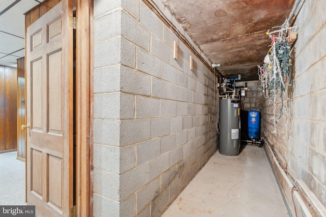 26140 Mullinix Mill Rd, Mount Airy, MD 21771 - basement featuring water heater, a water pressure tank, and concrete block wall