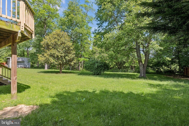 26140 Mullinix Mill Rd, Mount Airy, MD 21771 - view of grassy yard with a deck and view of wooded area