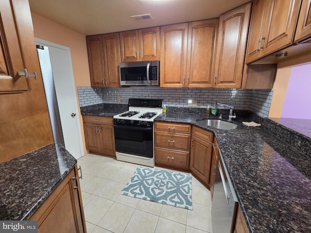 2704 Adams Ct, North Wales, PA 19454 - kitchen featuring stainless steel appliances, a sink, and brown cabinetry