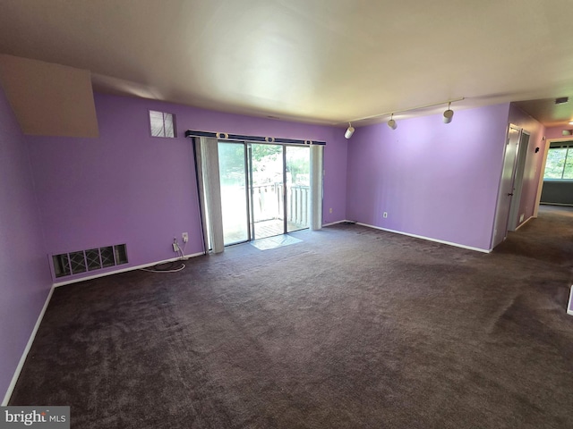 2704 Adams Ct, North Wales, PA 19454 - unfurnished room with rail lighting, dark colored carpet, and baseboards