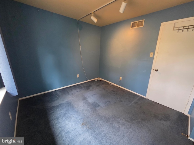 2704 Adams Ct, North Wales, PA 19454 - spare room with carpet floors, rail lighting, and baseboards