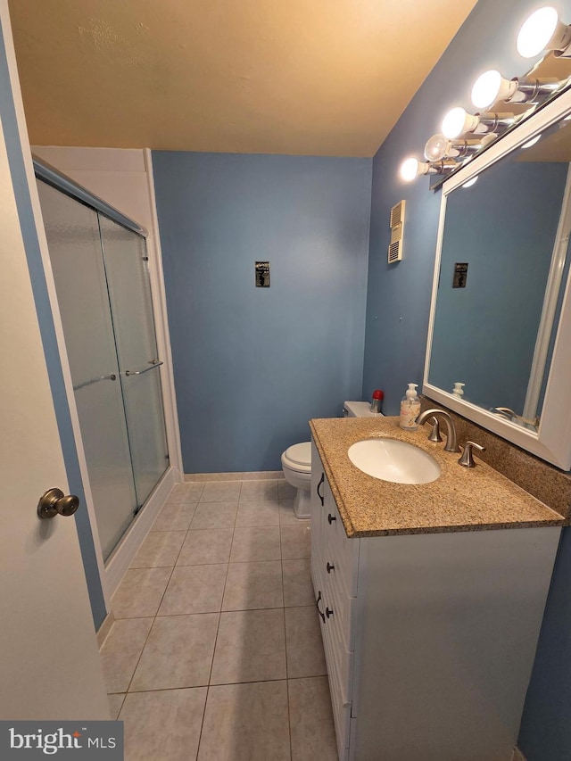 2704 Adams Ct, North Wales, PA 19454 - bathroom featuring vanity, a shower stall, tile patterned flooring, toilet, and baseboards