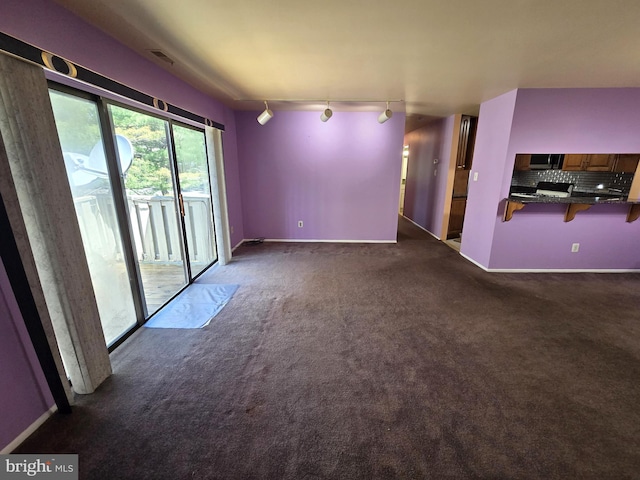 2704 Adams Ct, North Wales, PA 19454 - unfurnished living room featuring track lighting, carpet, and baseboards