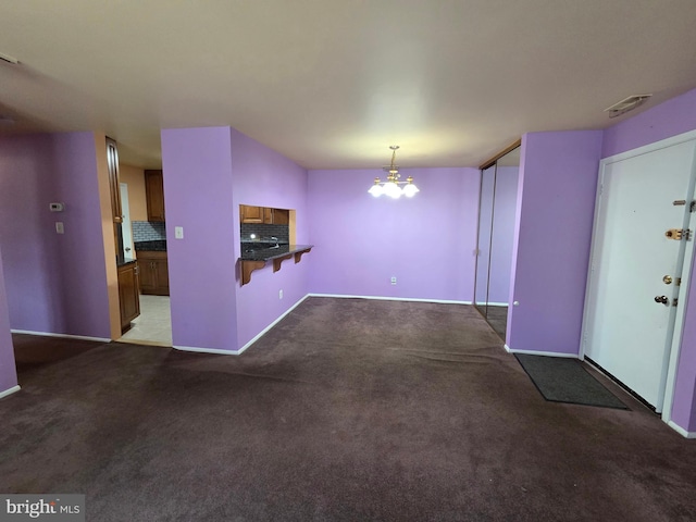 2704 Adams Ct, North Wales, PA 19454 - unfurnished living room featuring carpet flooring, a chandelier, and baseboards