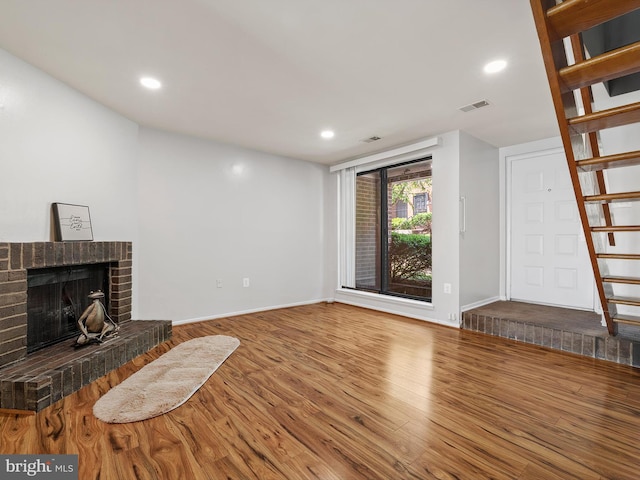 1806 Bryant St NE Unit 1806, Washington, DC 20018 - unfurnished living room with wood finished floors, a fireplace, baseboards, and recessed lighting