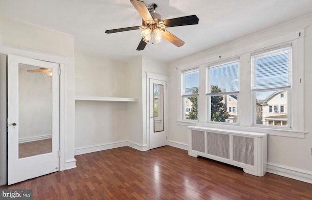 527 Brookside Ave, Lansdowne, PA 19050 - unfurnished living room featuring radiator, wood finished floors, baseboards, and ceiling fan