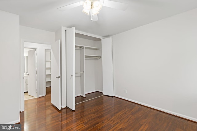 29 Stonehenge Cir Unit 6, Pikesville, MD 21208 - unfurnished bedroom featuring a closet, wood finished floors, baseboards, and a ceiling fan