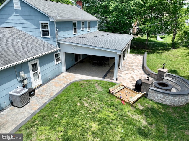 15709 Presswick Ln, Bowie, MD 20716 - back of house featuring roof with shingles, a fire pit, a patio, and central air condition unit