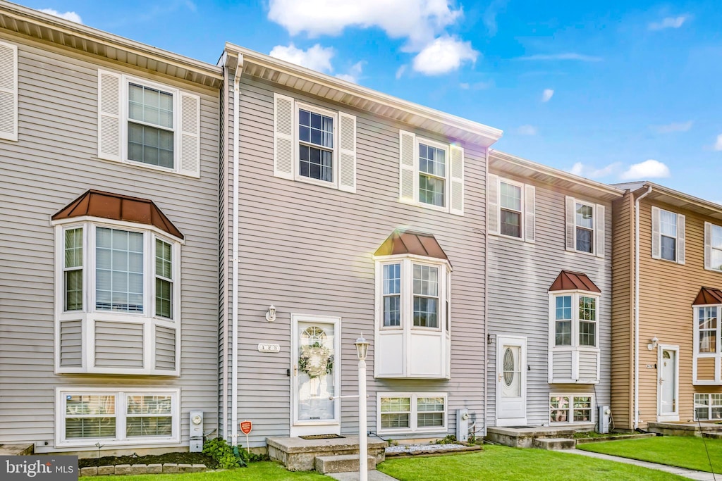 423 Kosoak Rd, Baltimore, MD 21220 - townhome / multi-family property with a front yard