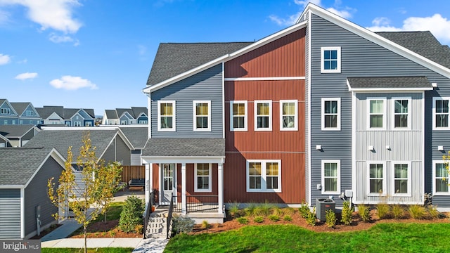 25493 Grassy Meadow Dr, Aldie, VA 20105 - view of front facade featuring central AC, roof with shingles, a porch, and a residential view