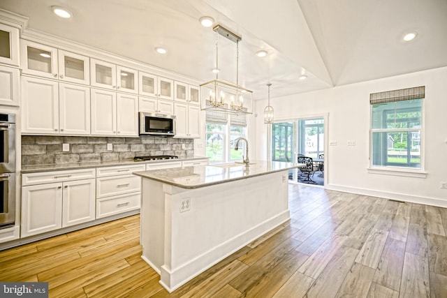 35024 Black Walnut Dr, Lewes, DE 19958 - kitchen featuring appliances with stainless steel finishes, a sink, white cabinetry, light wood-style floors, and recessed lighting