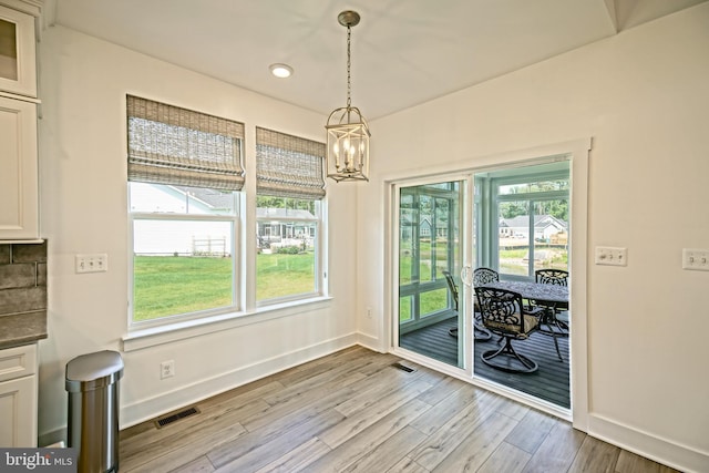 35024 Black Walnut Dr, Lewes, DE 19958 - unfurnished dining area featuring a chandelier, light wood-style flooring, baseboards, and recessed lighting