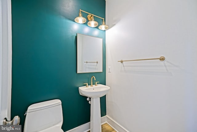 35024 Black Walnut Dr, Lewes, DE 19958 - bathroom with toilet, baseboards, and wood finished floors