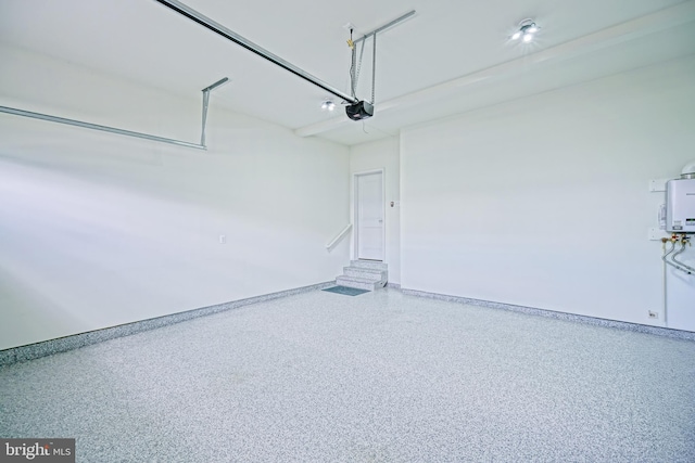 35024 Black Walnut Dr, Lewes, DE 19958 - garage featuring a garage door opener and baseboards