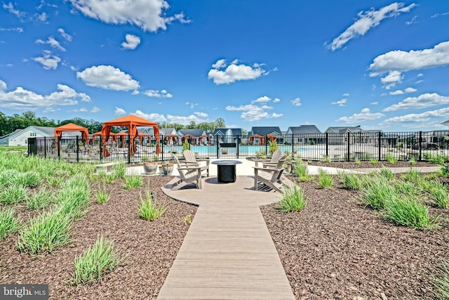 35024 Black Walnut Dr, Lewes, DE 19958 - surrounding community featuring a gazebo, an outdoor fire pit, and a patio