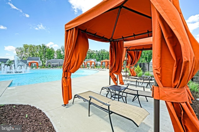 35024 Black Walnut Dr, Lewes, DE 19958 - surrounding community with a gazebo, a swimming pool, and a patio area