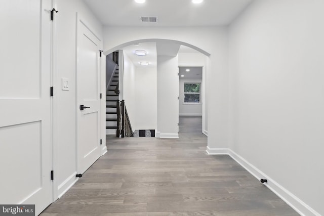 7746 16th St NW, Washington, DC 20012 - corridor featuring arched walkways, wood finished floors, baseboards, stairs, and recessed lighting