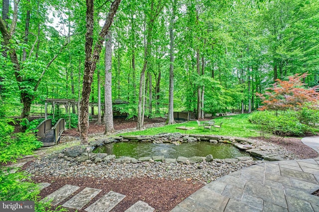 5026 Huntwood Manor Dr, Fairfax, VA 22030 - view of yard with a garden pond