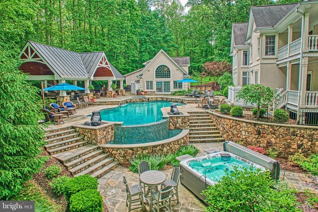 5026 Huntwood Manor Dr, Fairfax, VA 22030 - swimming pool with a hot tub, an exterior structure, stairway, an outdoor structure, and a patio