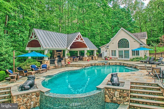 5026 Huntwood Manor Dr, Fairfax, VA 22030 - view of pool with an exterior structure, a patio area, an outdoor structure, and an outdoor fire pit