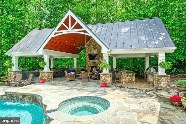 5026 Huntwood Manor Dr, Fairfax, VA 22030 - outdoor pool featuring a gazebo, an outdoor kitchen, a patio area, an outdoor living space with a fireplace, and ceiling fan