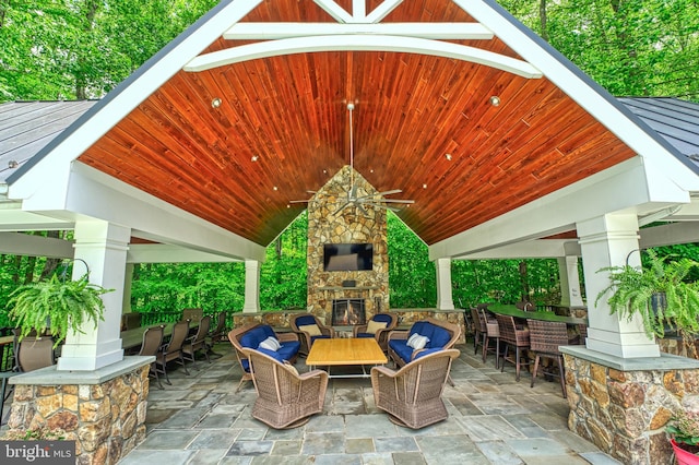 5026 Huntwood Manor Dr, Fairfax, VA 22030 - view of patio / terrace featuring an outdoor living space with a fireplace, a gazebo, a ceiling fan, and an outdoor bar