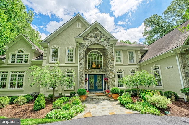 5026 Huntwood Manor Dr, Fairfax, VA 22030 - view of front of home with stone siding, stucco siding, and french doors