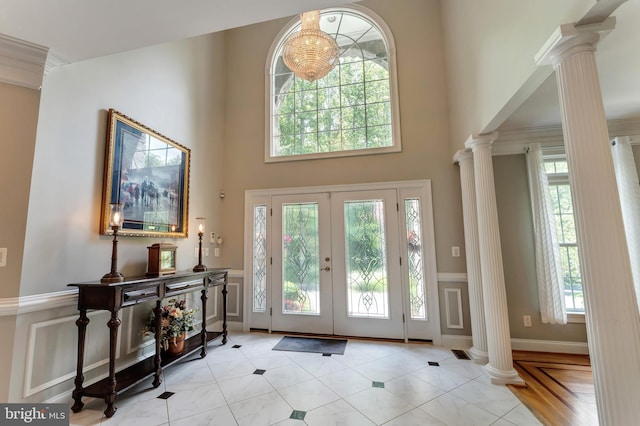 5026 Huntwood Manor Dr, Fairfax, VA 22030 - entryway featuring decorative columns, a high ceiling, wainscoting, and french doors