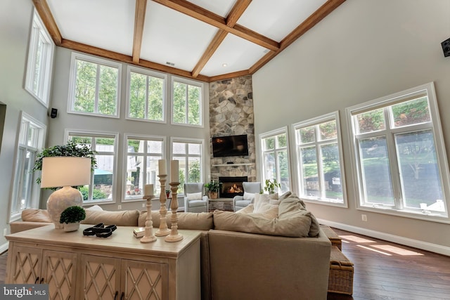 5026 Huntwood Manor Dr, Fairfax, VA 22030 - living area with a towering ceiling, plenty of natural light, baseboards, beamed ceiling, and a fireplace