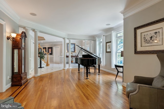 5026 Huntwood Manor Dr, Fairfax, VA 22030 - sitting room with decorative columns, light wood-type flooring, crown molding, and baseboards