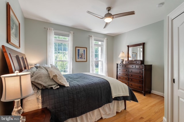 5026 Huntwood Manor Dr, Fairfax, VA 22030 - bedroom featuring light wood-style flooring, a ceiling fan, and baseboards
