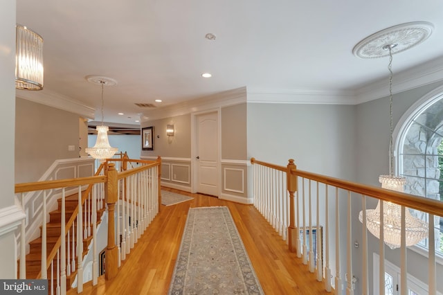5026 Huntwood Manor Dr, Fairfax, VA 22030 - hallway featuring an upstairs landing, a chandelier, light wood finished floors, ornamental molding, and recessed lighting