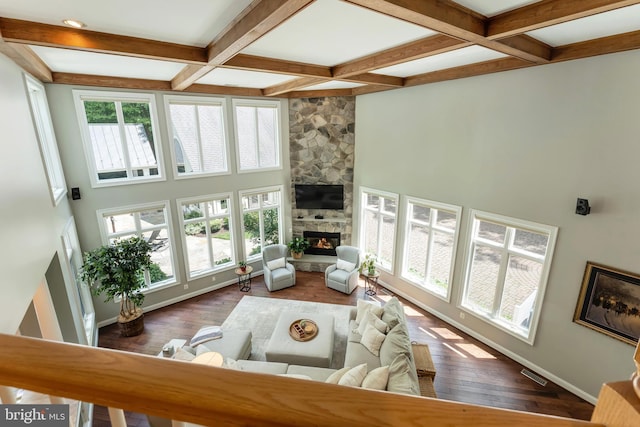 5026 Huntwood Manor Dr, Fairfax, VA 22030 - living area with a stone fireplace, beamed ceiling, coffered ceiling, baseboards, and wood finished floors