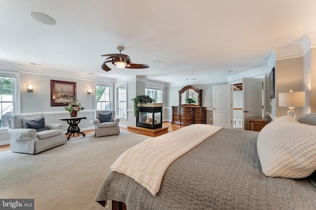 5026 Huntwood Manor Dr, Fairfax, VA 22030 - bedroom with crown molding, a multi sided fireplace, and carpet flooring