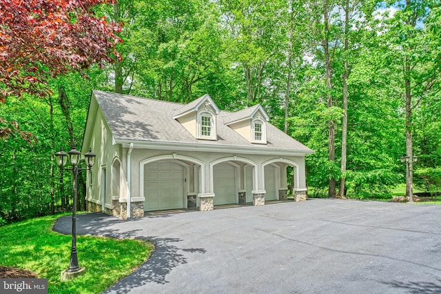 5026 Huntwood Manor Dr, Fairfax, VA 22030 - garage featuring view of wooded area