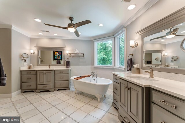 5026 Huntwood Manor Dr, Fairfax, VA 22030 - bathroom with a ceiling fan, two vanities, a freestanding bath, tile patterned flooring, and recessed lighting